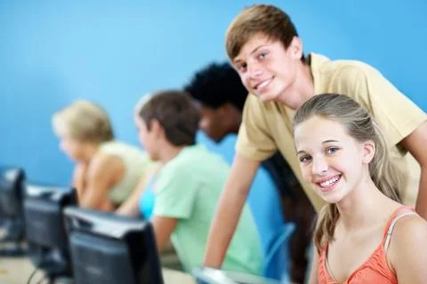 Computer, learning and portrait with friends in classroom for education, te.. Stock Photos