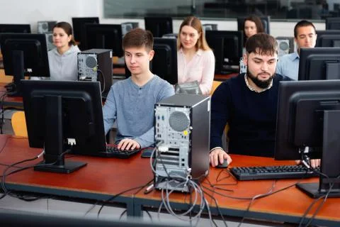 Computer lessons for adults in classroom Fotos de archivo