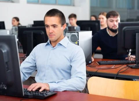 Computer lessons for adults in classroom Fotos de archivo