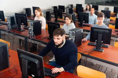 Computer lessons for adults in classroom Foto stock
