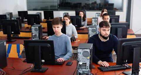 Computer lessons for adults in classroom Fotos de archivo