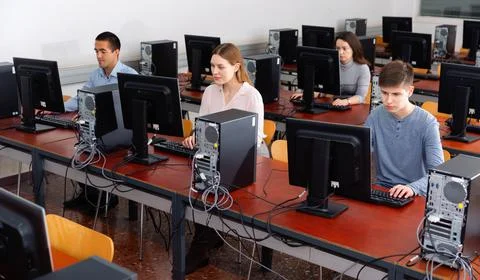 Computer lessons for adults in classroom Fotos de archivo