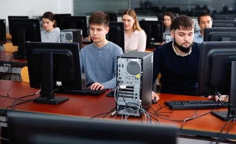Computer lessons for adults in classroom Fotos de archivo