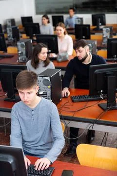 Computer lessons for adults in classroom Fotos de archivo