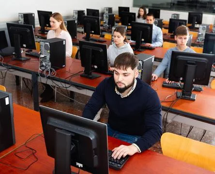 Computer lessons for adults in classroom Foto stock