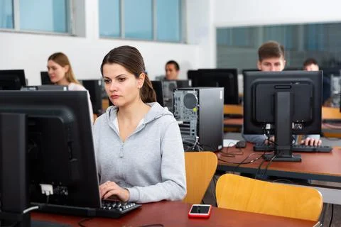 Computer lessons for adults in classroom Fotos de archivo