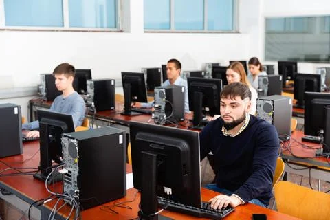 Computer lessons for adults in classroom Fotos de archivo