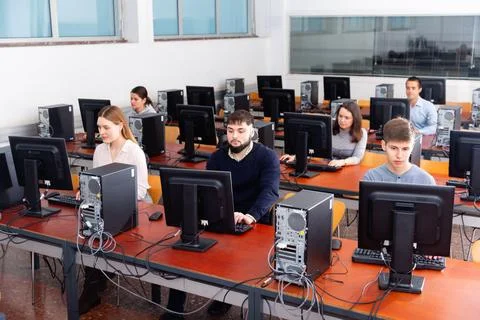 Computer lessons for adults in classroom Fotos de archivo