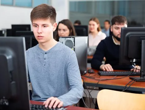 Computer lessons for adults in classroom Fotos de archivo
