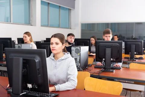 Computer lessons for adults in classroom Stock Photos