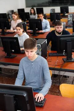 Computer lessons for adults in classroom Fotos de archivo