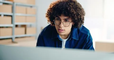 Computer, logistics and problem solving with business man in office for delivery Stock Photos