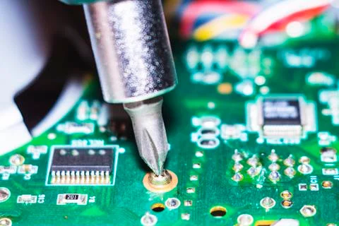 Computer in macro. Various details of computer components in closeup. Screwdr Stock Photos