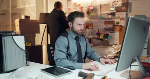 Computer, man and detective in office with typing for research on case with Stock Footage 314793813
