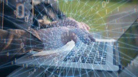 Computer man programmer or hacker prints a code on a laptop keyboard to break Stock Footage 120869768