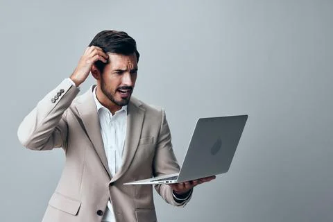 Computer man work smiling laptop suit job copyspace internet business freelancer Stock Photos