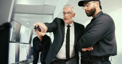 Computer, manager or security guard with planning in control room, video footage Stock Photos
