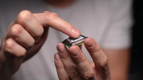 Computer master applying and smearing new thermal paste to PC CPU processor chip Stock Footage 276423339