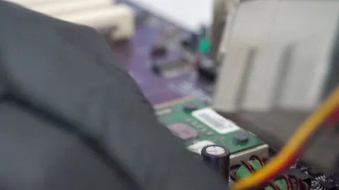 The computer master changes the computer chip, the processor on the motherboard Stock Footage 157597726