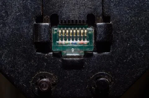 The computer master connects and tightens the RJ-45 connecting jack connector fo Stock Photos