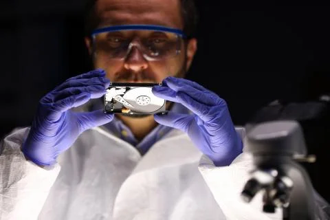 Computer master holding hdd Stock Photos