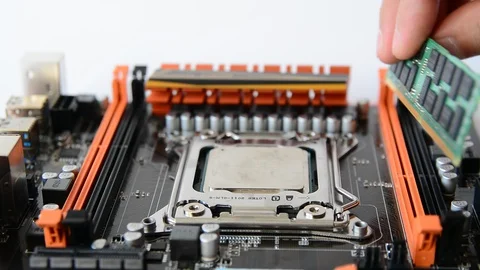 The computer master installs the main memory in the motherboard slot. Stock Footage 91220029