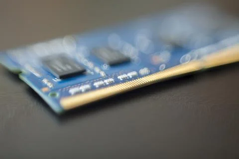 Computer memory chip placed on top of a black table. Connections and circuits Stock-Fotos