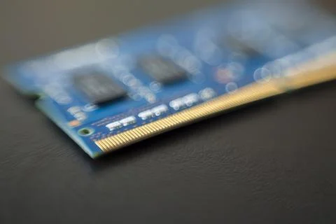 Computer memory chip placed on top of a black table. Connections and circuits Stock-Fotos