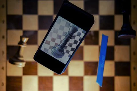 Computer memory, phone and retro chess board with chess pieces. Concept of te Stock Photos