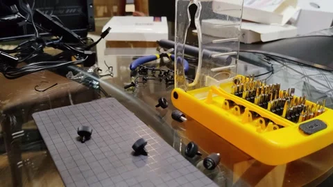 Computer metal self tapping screws falling on magnet mat, spill out screw Stock Footage 302347095