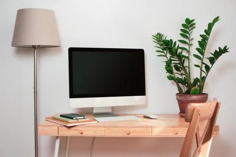 Computer with mockup screen on office table Stock Photos