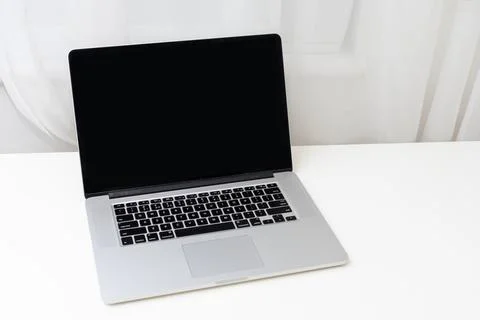 Computer mockup white background on table. Laptop with blank screen Stock Photos