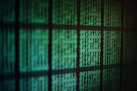 Computer monitor displaying binary code. block of data on computer led panel Foto stock