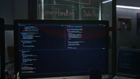 Computer Monitor Displaying Software Code at Office Workstation 스톡 동영상 348358652