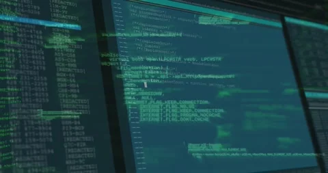 Computer monitor showing code editor with green entries and white code snippets Stock Footage 328978422