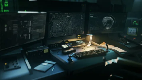 Computer monitors in control room showing the spying tech looking for criminals Stock Footage 303563423
