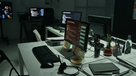 Computer Monitors Displaying Cyber Attack Data in Empty Office Stock Footage 346696997