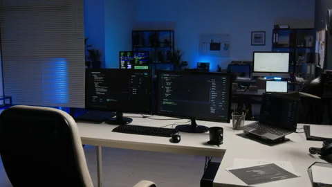 Computer Monitors Displaying Cybersecurity Code in Modern Office Stock Footage 347288006