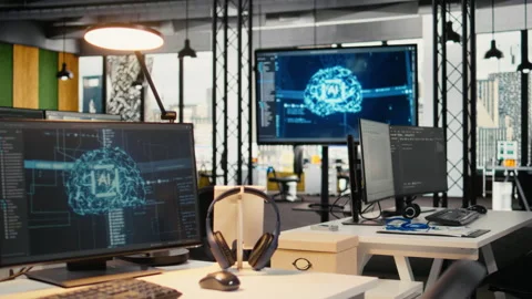 Computer monitors in empty startup workspace with cloud computing AI resources Stock Footage 323030329