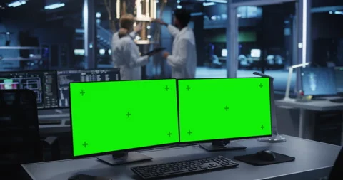Computer Monitors with Green Screen in Research Office Stock Footage 318967443