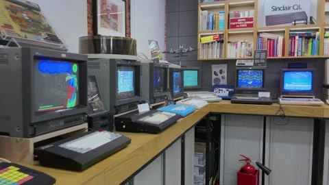 Computer monitors with keyboards displaying games in exhibit Stock Footage 270170078