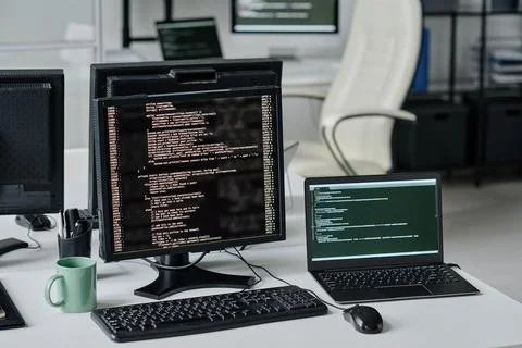 Computer monitors with program codes Foto stock