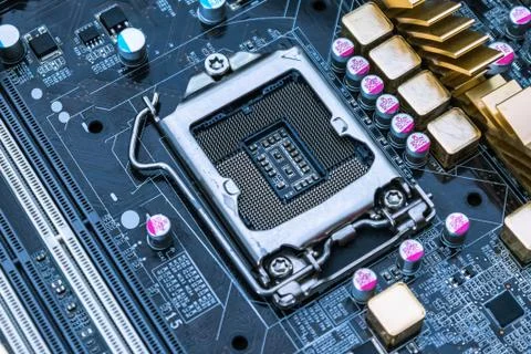 Computer motherboard and its processor socket close-up Stock Photos