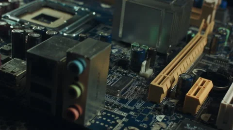 Computer motherboard isolated in white background with a person hand placing an Stock Footage 68954765