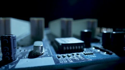 Computer motherboard microcircuit with chips, slots, capacitors and socket for Stock Footage 182413291