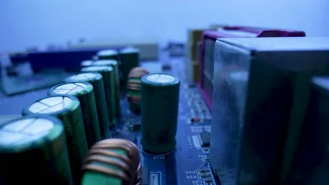 Computer motherboard microcircuit with chips, slots, capacitors and processor in Stock Footage 182416099