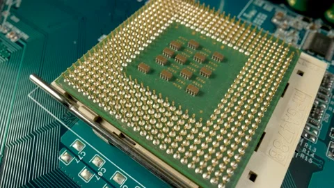 Computer motherboard with processor, capacitors, chips and induction coils Stock Footage 182402912