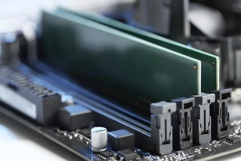 Computer motherboard with RAM chip on table, closeup. Electronic engineering Stock-Fotos