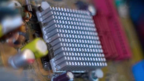 On computer motherboard there are microchips, with a heatsink for heat removal Stock Footage 259798747
