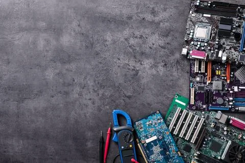 Computer motherboards on grey table, flat lay with space for text. Electronic 写真素材